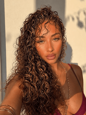 2C/3A deep wave hair extensions in a natural shade